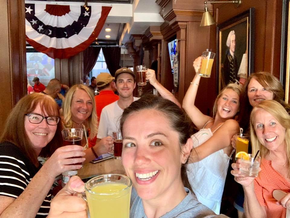 Lexie American Flag a group of people are drinking from a wine glass posing for the camera