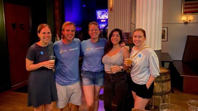a group of people standing in a room